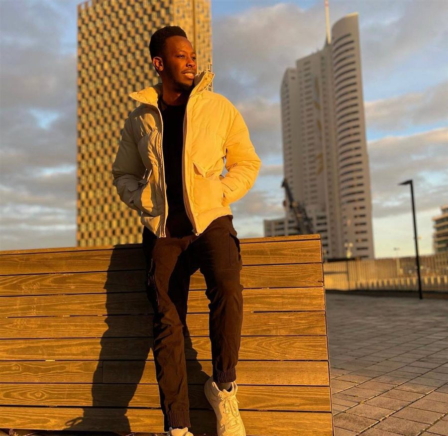 Jerry Bogonko, founder of Beyond Borders KE, standing outdoors in a European city.